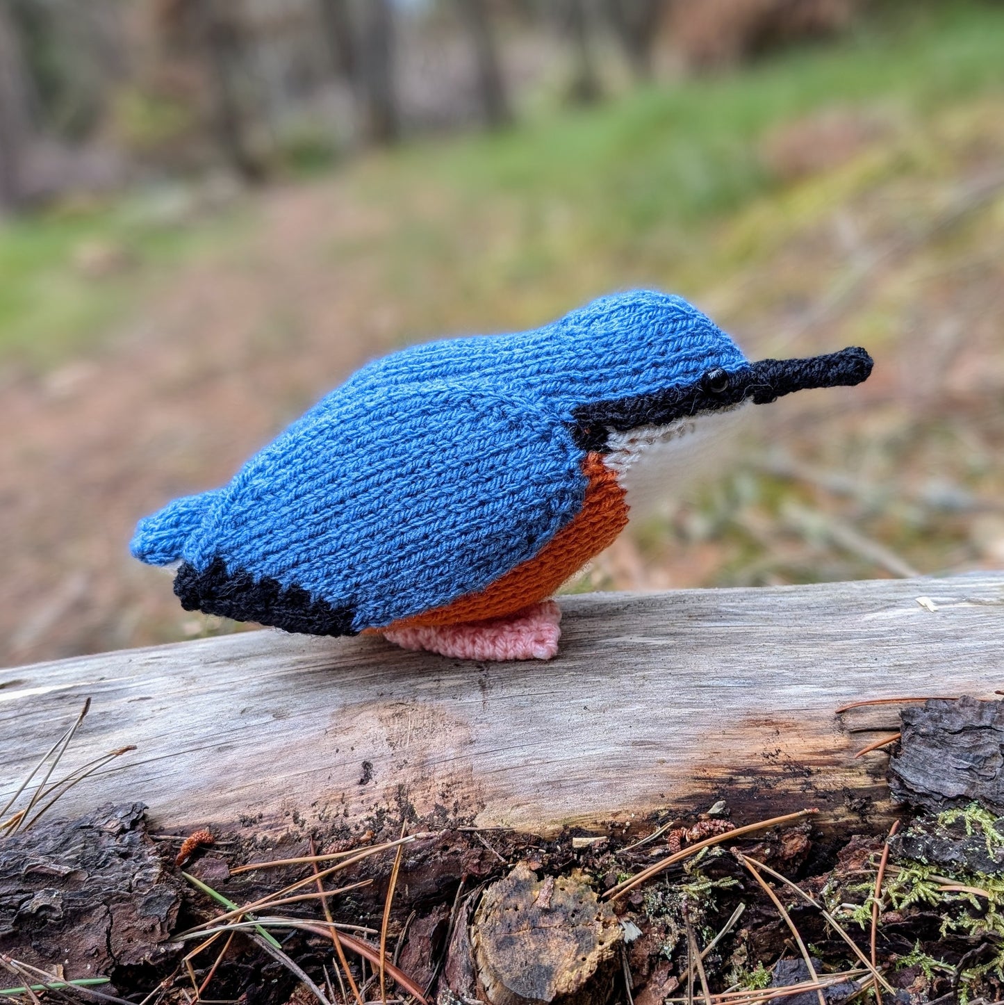 Nuthatch in a wood knitted by Nicky Stewart